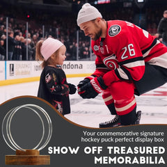 Close-up of acrylic hockey puck holder showing crystal-clear display and sturdy wooden base