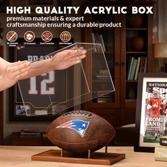 Close-up of football holder display case with solid wood base and floating acrylic support rods