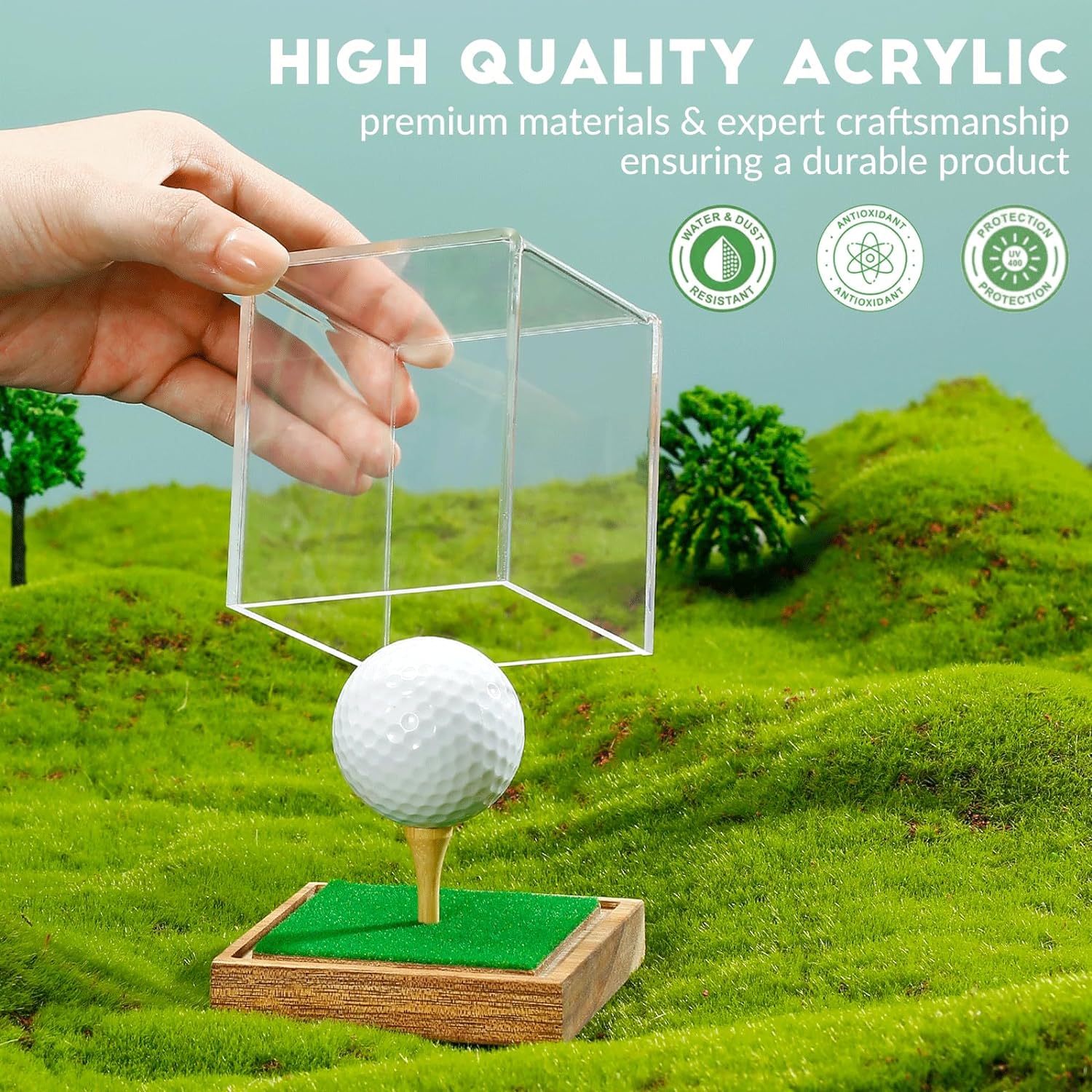 Golf ball securely placed on wood tee inside acrylic golf ball case